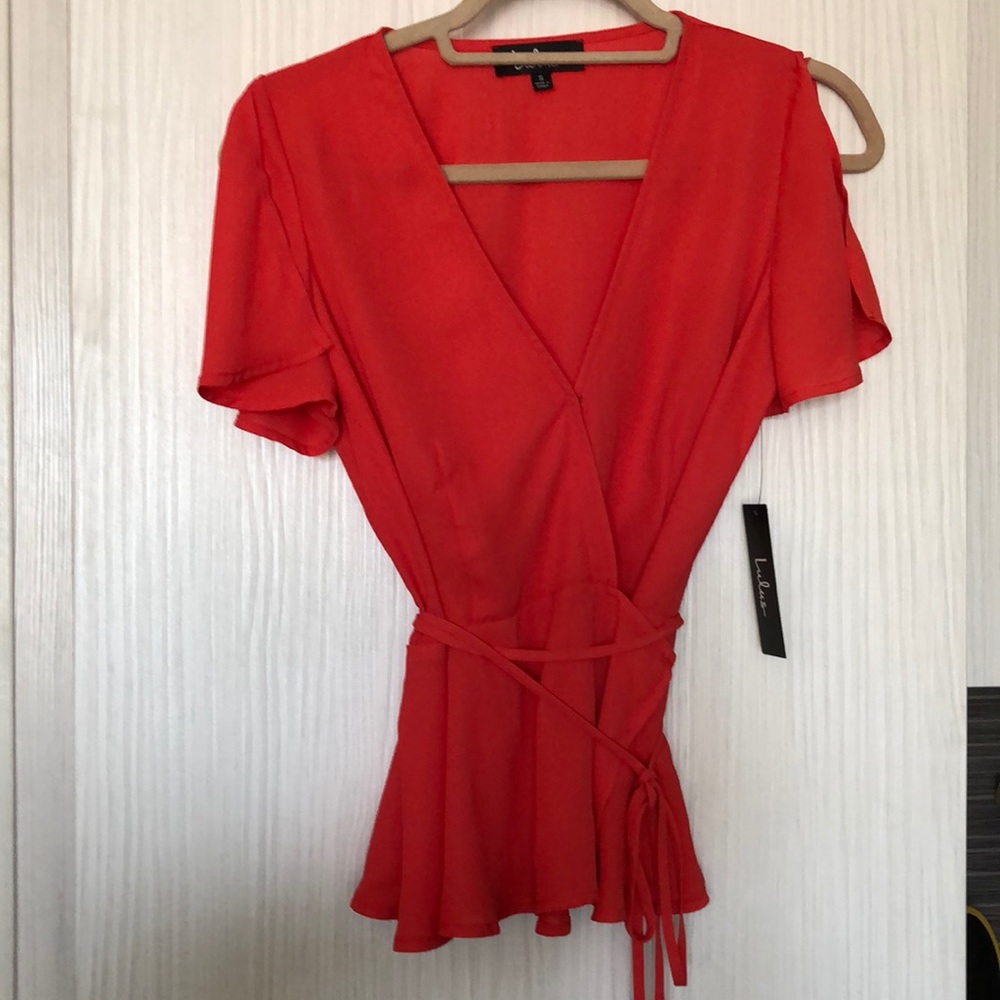 Lulu’s wrap peplum top with clasp, split sleeve